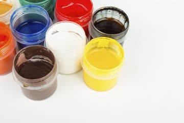 Jars with a colorful paint gouache. Stock Image macro.