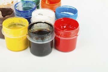 Jars with a colorful paint gouache. Stock Image macro.