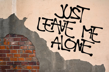 Just Leave Me Alone - Handwritten graffiti sprayed on the wall, anarchist aesthetics - wish to be...