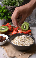 preparation of breakfast with flakes of oats