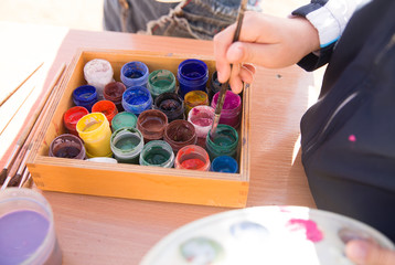 Jars of paint are on the table