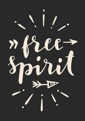 Free Spirit. Hand lettering. Modern calligraphic retro style poster design with a black backdrop, arrows and sunburst. Artistic hand drawn postcard