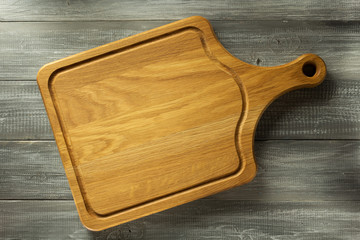 cutting board at wooden table