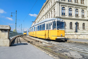 Fototapeta na wymiar Historic yellow trams in central Budapest