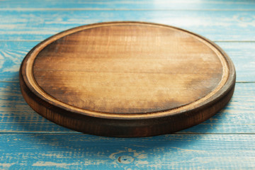 pizza cutting board at rustic background