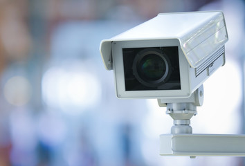 cctv camera or security camera on retail shop blurred background