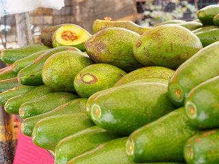 Fresh green avocado on a market