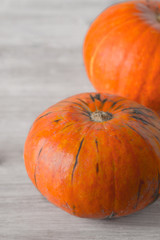 Pumpkins on the white table vertical
