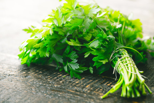 Bunch of parsley on the wooden table