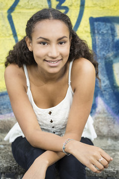 Portrait of smiling teenage girl wearing top