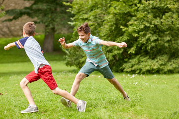 happy kids running and playing game outdoors