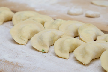 Fototapeta na wymiar Vareniki dumplings or pelmeni before boiling