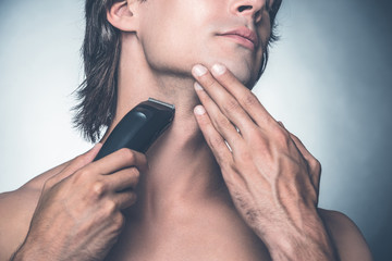 Shaving with electric razor. 
