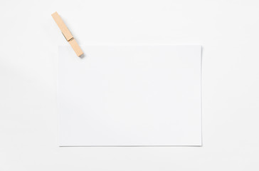 Blank stack of paper and wooden pin