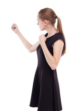 skinny woman funny fights waving his arms and legs. Blonde in a short black dress clenched her fists.