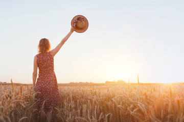 goodbye or parting background, farewell, woman waving hand in the field - obrazy, fototapety, plakaty