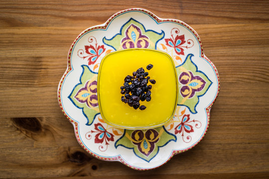Turkish Traditional Dessert Zerde Pudding with Raisin.