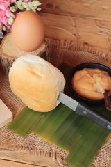 bread with custard delicious on wood background.
