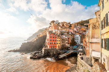 Fototapeta na wymiar Landscape view on the old coastal famous town Riomaggiore in the small valley in the Liguria region of Italy