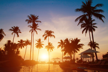 Fototapeta na wymiar summer holidays, paradise tropical beach background, luxurious hotel at sunset