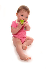 Baby girl playing with wooden block