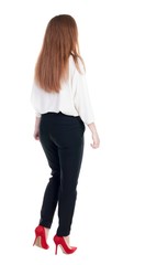 walking red head business woman. back view. going young girl in  suit. Rear view people collection.  back side view of person.  Isolated over white background.