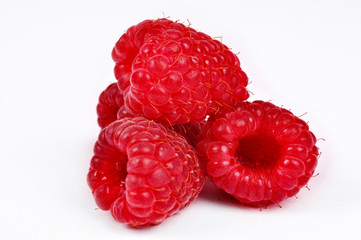 Ripe red raspberries isolated on white background 
