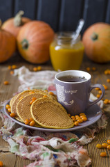 Pumpkin pancakes with sea buckthorn sauce for breakfast  