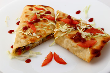 Mexican tacos with meat, beans and salsa.