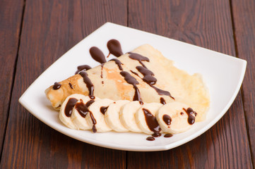 Crepes with bananas and cream 