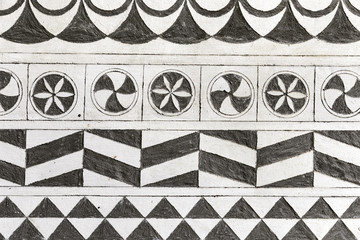Hand-carved wall background decorated with local motifs in Pyrgi, Chios Island, Greece.