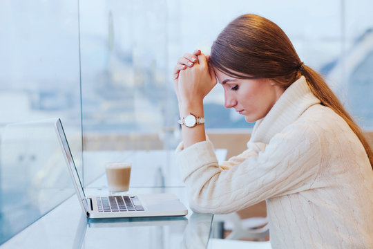 information overload, stress concept, sad desperate woman in front of computer