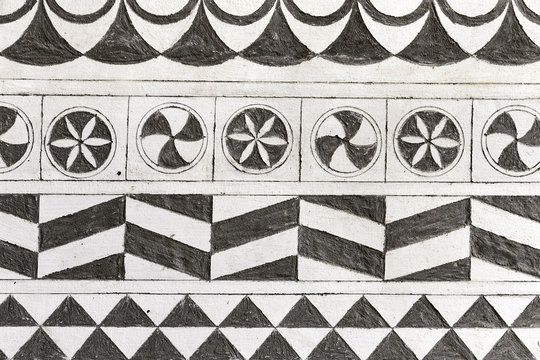 Hand-carved wall background decorated with local motifs in Pyrgi, Chios Island, Greece.