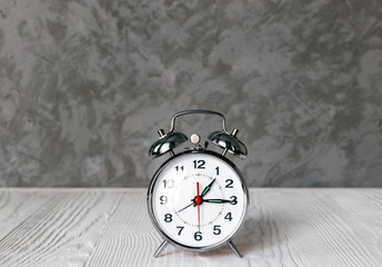 alarm clock at empty locker on white background