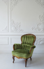 elegant green armchair in luxury clean bright white interior