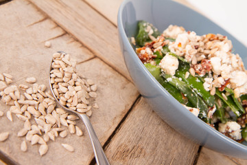 Spinach, dried tomatoes, feta cheese and sunflower seeds salad