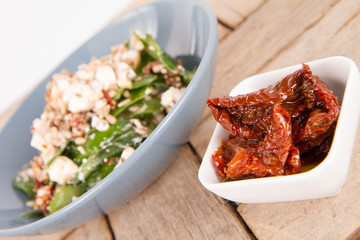 Spinach, dried tomatoes, feta cheese and sunflower seeds salad
