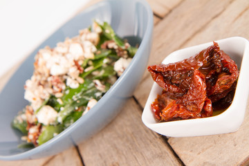Spinach, dried tomatoes, feta cheese and sunflower seeds salad