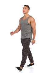 Fototapeta premium Walking Young Man In Camo Pants