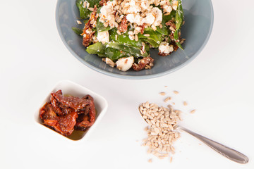 Spinach, dried tomatoes, feta cheese and sunflower seeds salad