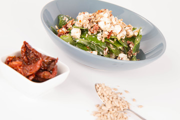 Spinach, dried tomatoes, feta cheese and sunflower seeds salad