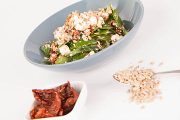 Spinach, dried tomatoes, feta cheese and sunflower seeds salad