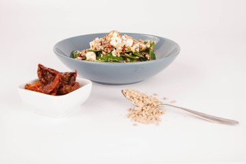 Spinach, dried tomatoes, feta cheese and sunflower seeds salad