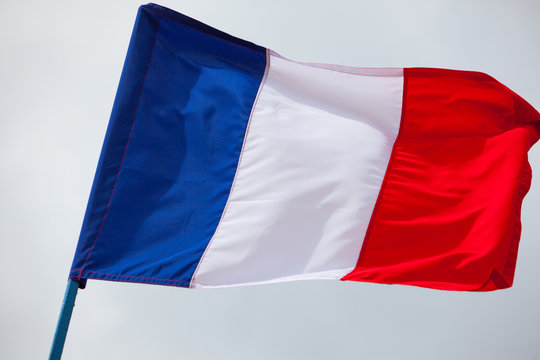 France flag waving close up on the sky