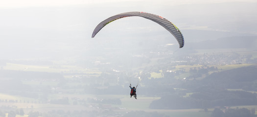 paraglider in the sky - obrazy, fototapety, plakaty