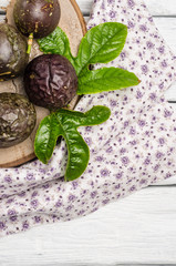 Passion fruits on wooden background