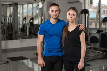 Fototapeta na wymiar Fit Couple At The Gym Looking Very Attractive