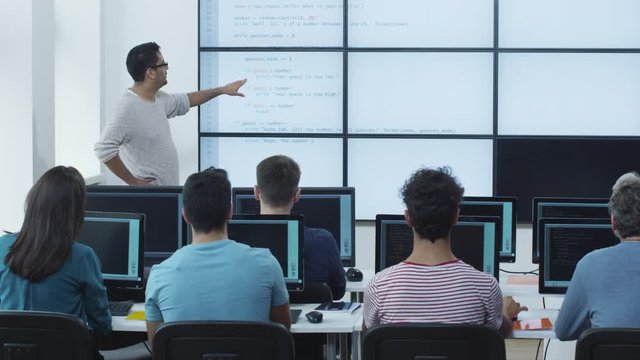 Group of Students on Lecture in Computer Class. Shot on RED Cinema Camera in 4K (UHD).