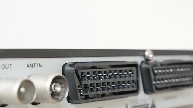 Modern DVB TV receiver back connectors for antenna and scart devices 4K 3840X2160 UltraHD tilting footage - Connectors of modern digital terrestrial television slow tilt 4K 2160p 30fps UHD video