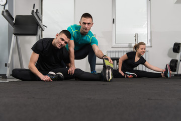 Gym People Stretching And Looking Very Happy